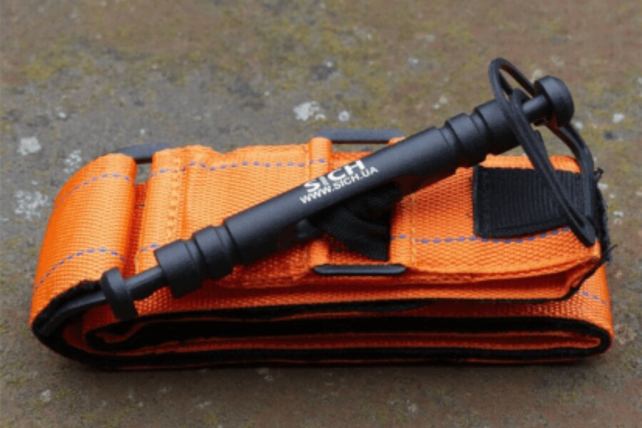 Turnichet portocaliu SICH cu clemă metalică și construcție solidă. Foto: Sich, Rigad