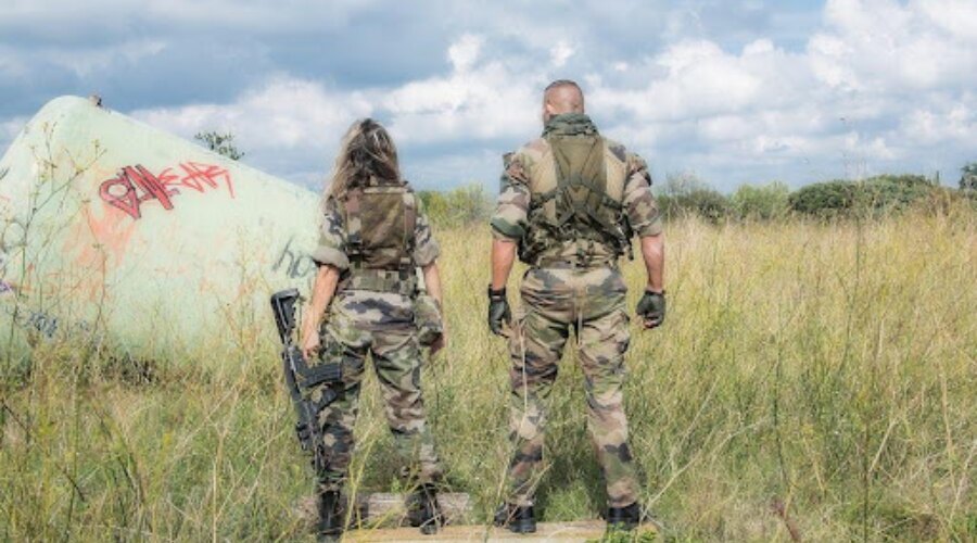 man and woman in army style